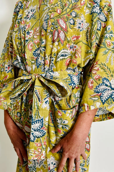 'Lime Grove' kimono made from hand-blocked printed cotton in soft lime large scale floral motif by Caro London