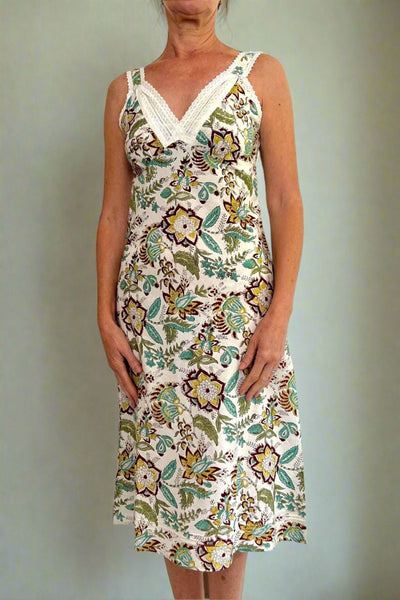 Very Lacey nightie is a bias cut slip, has soft gathering over the bust, adjustable straps, french seams, layered lace neck trim and is made from hand block print large scale floral in greens, turquoise, soft yellow and dark red on white ground