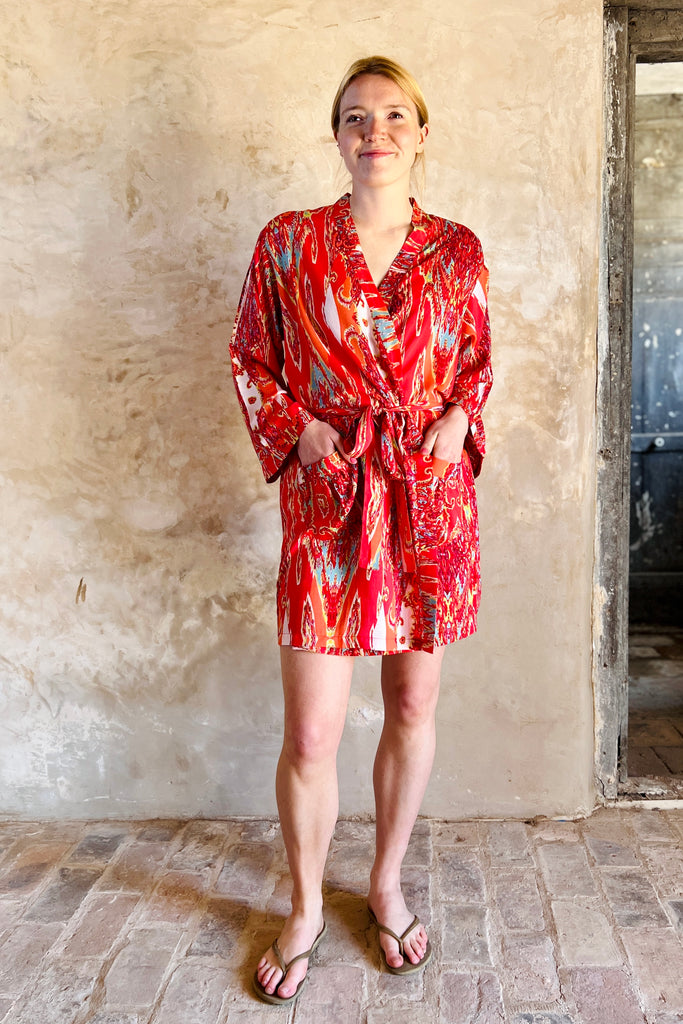 short kimono robe in red white and turquoise swirly abstract print on viscose fabric by caro london