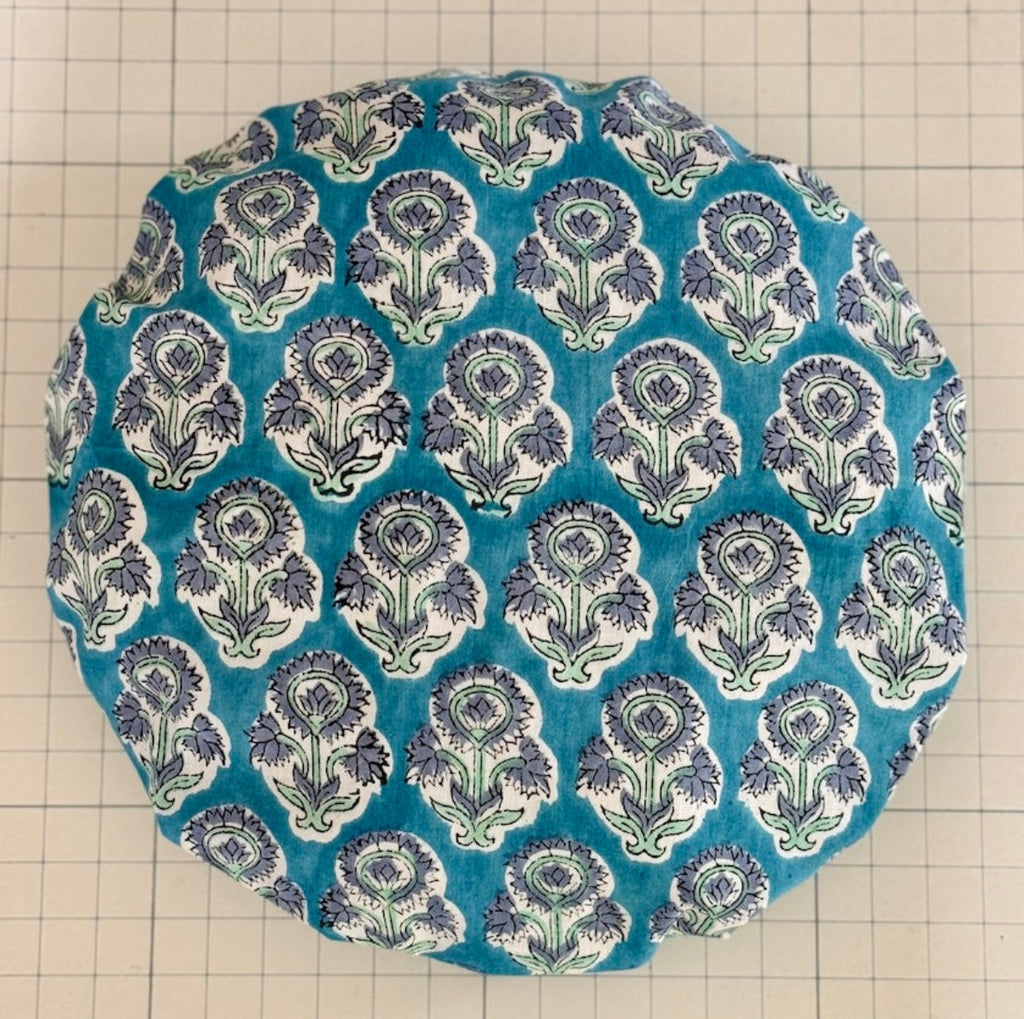 Mid blue repeating floral motif cotton bath hat