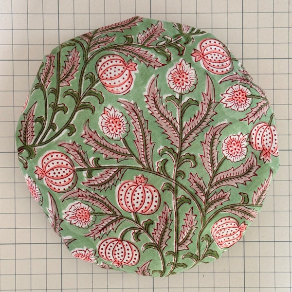 bath hat made from seedpod winding floral in green and pink