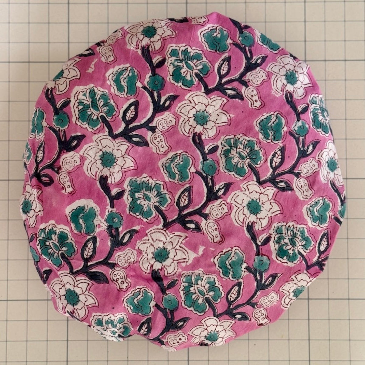 Striking all over print pink, green and white floral bath hat