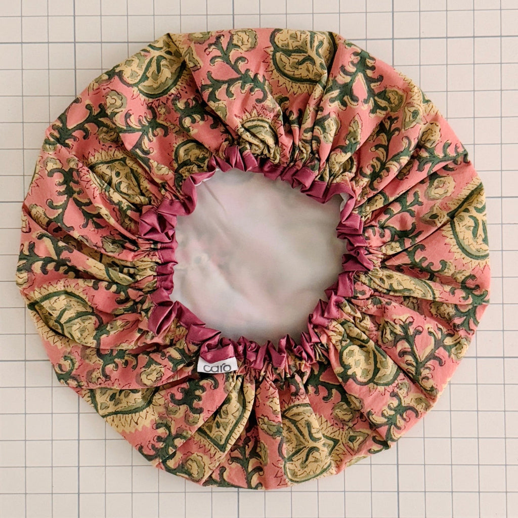 Patterned shower cap on a grid background