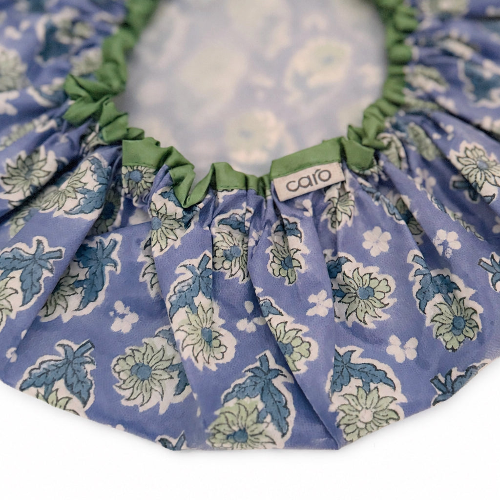 close up of blue, green and white Tea Dance vintage floral print waterproof shower cap