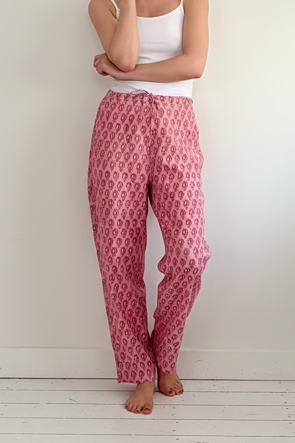 Full length of woman wearing Pink floral print easy Fit pyjama Bottoms and white camisole