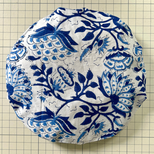 Cotton Bath hat in oversize blue floral on white ground for bathing in the bath