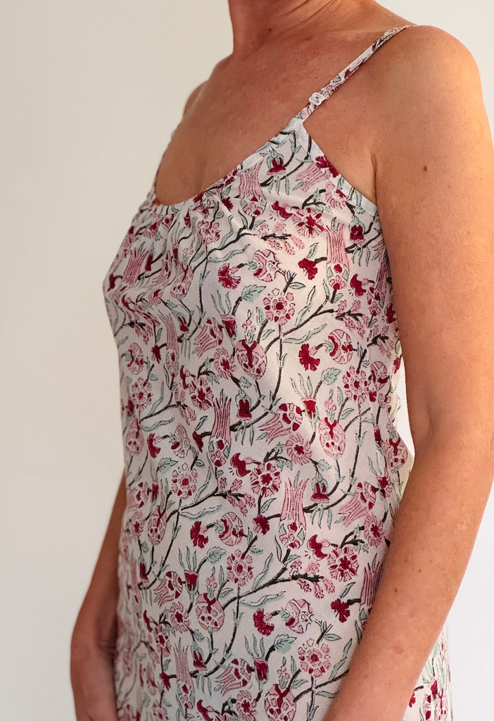 Floral patterned top worn by a person on a plain background