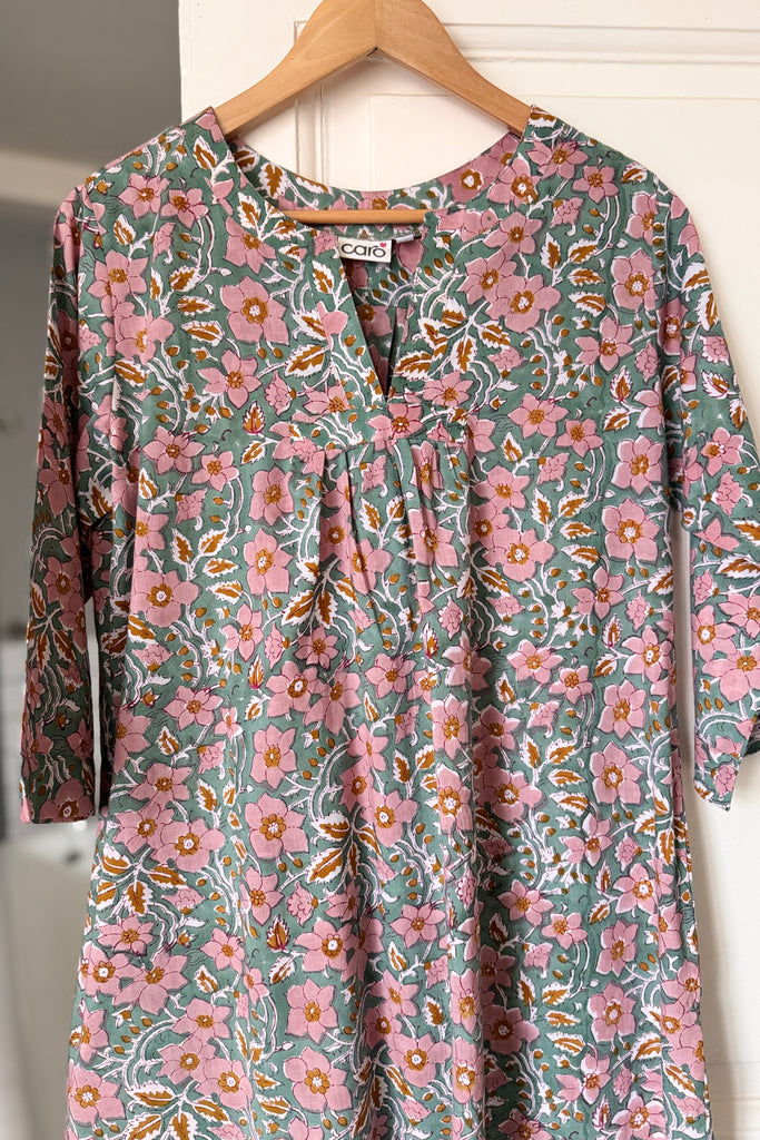 Floral nightdress on a hanger against a white background
