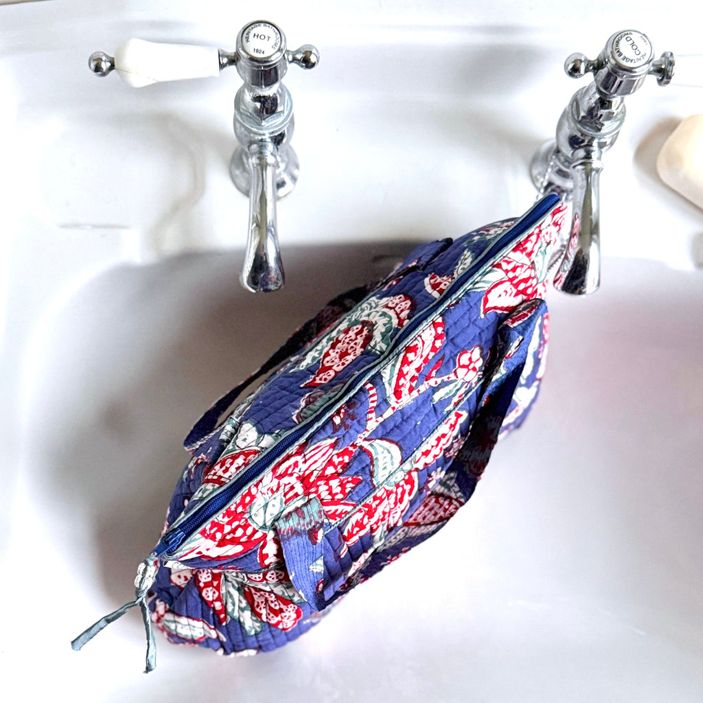 Blue and Red floral print Washbag on white sink