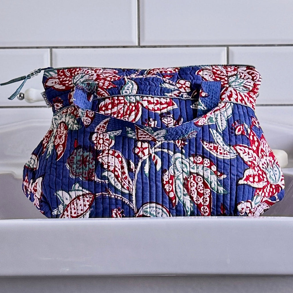 Blue and Red floral print Washbag on white sink