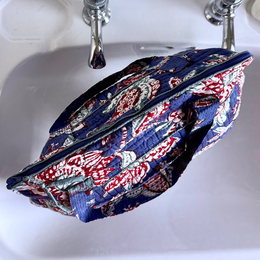Blue and Red floral print Washbag on white sink