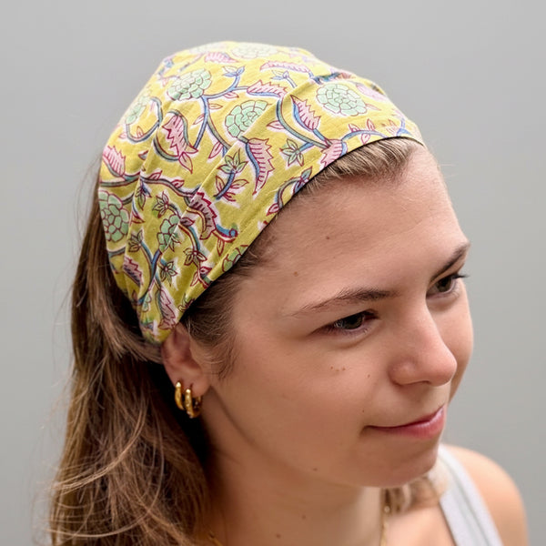 Woman wearing a colorful headband with a natural background