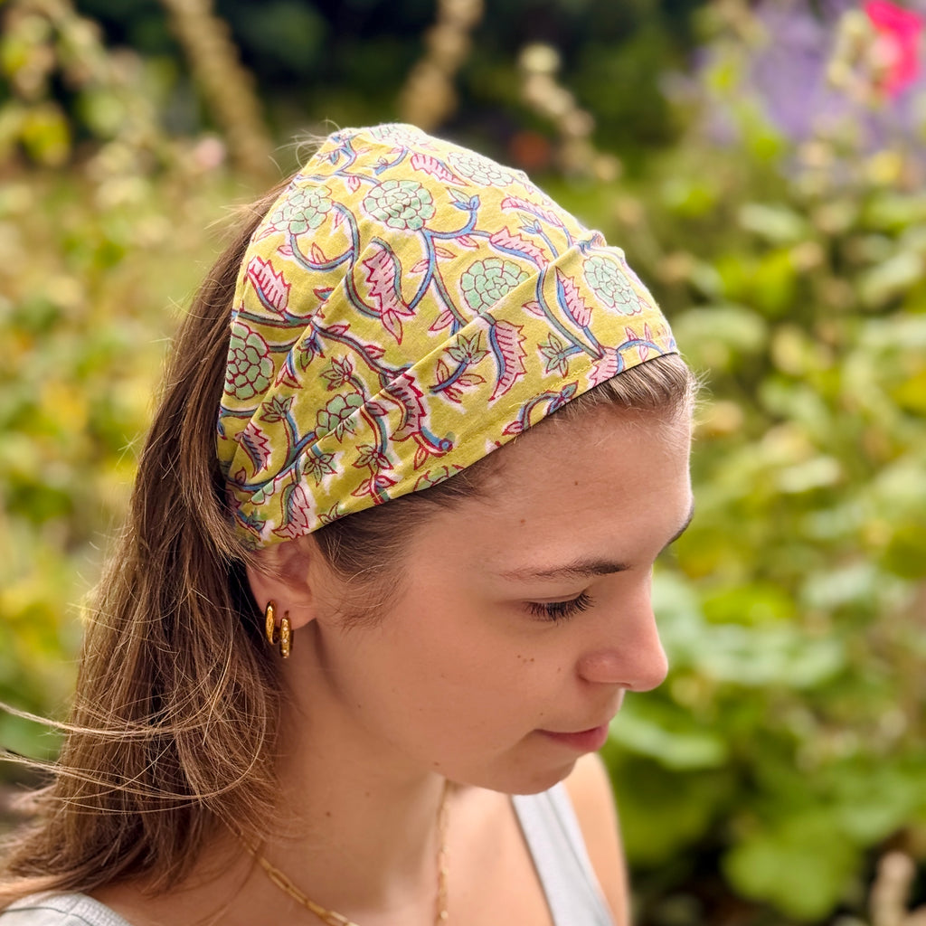 Woman wearing a colorful headband with a natural background