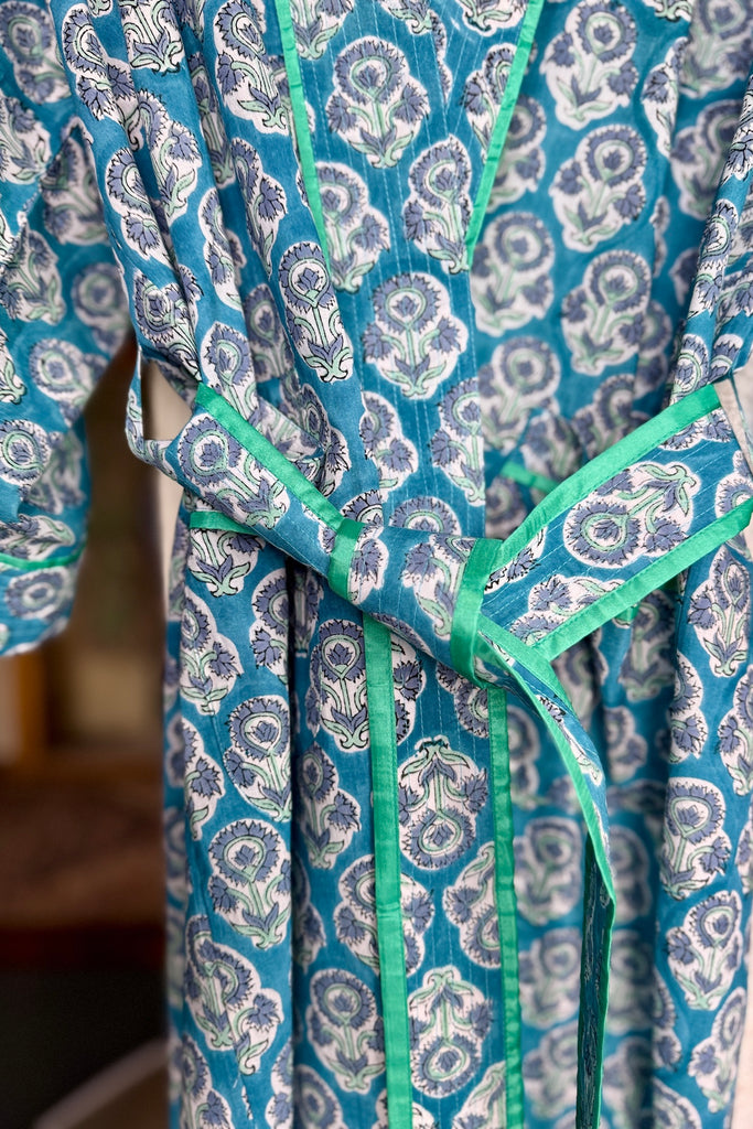 Blue patterned kimono robe with green trim 