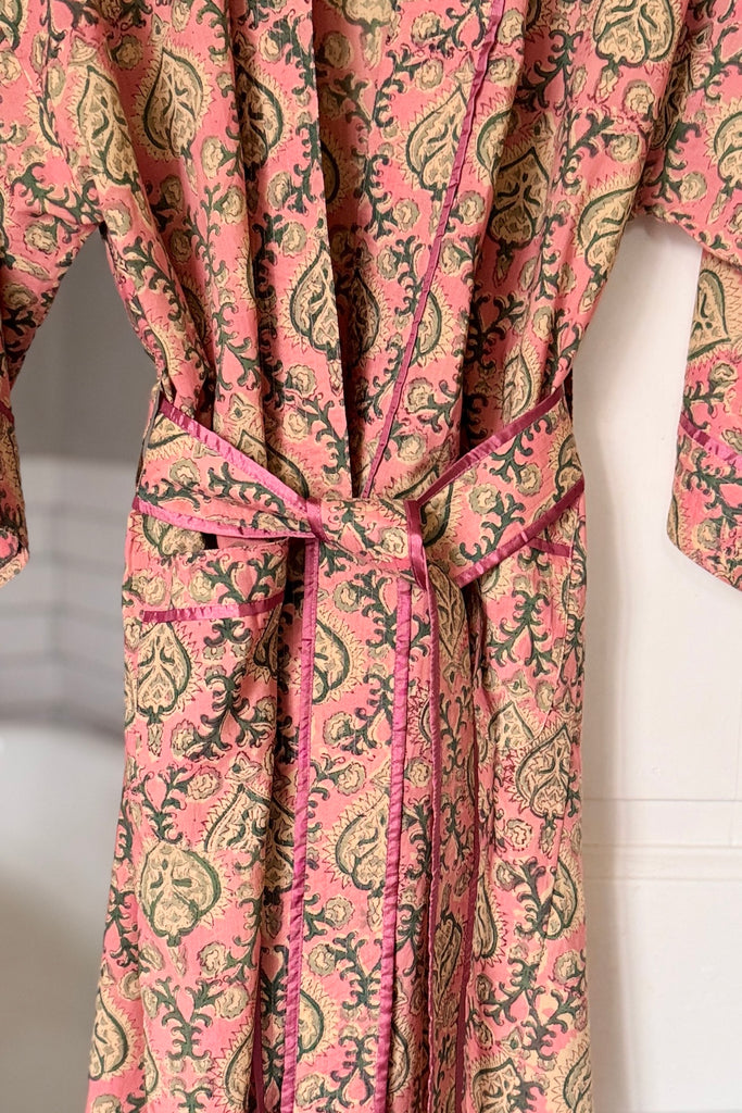 Pink patterned robe on a white background