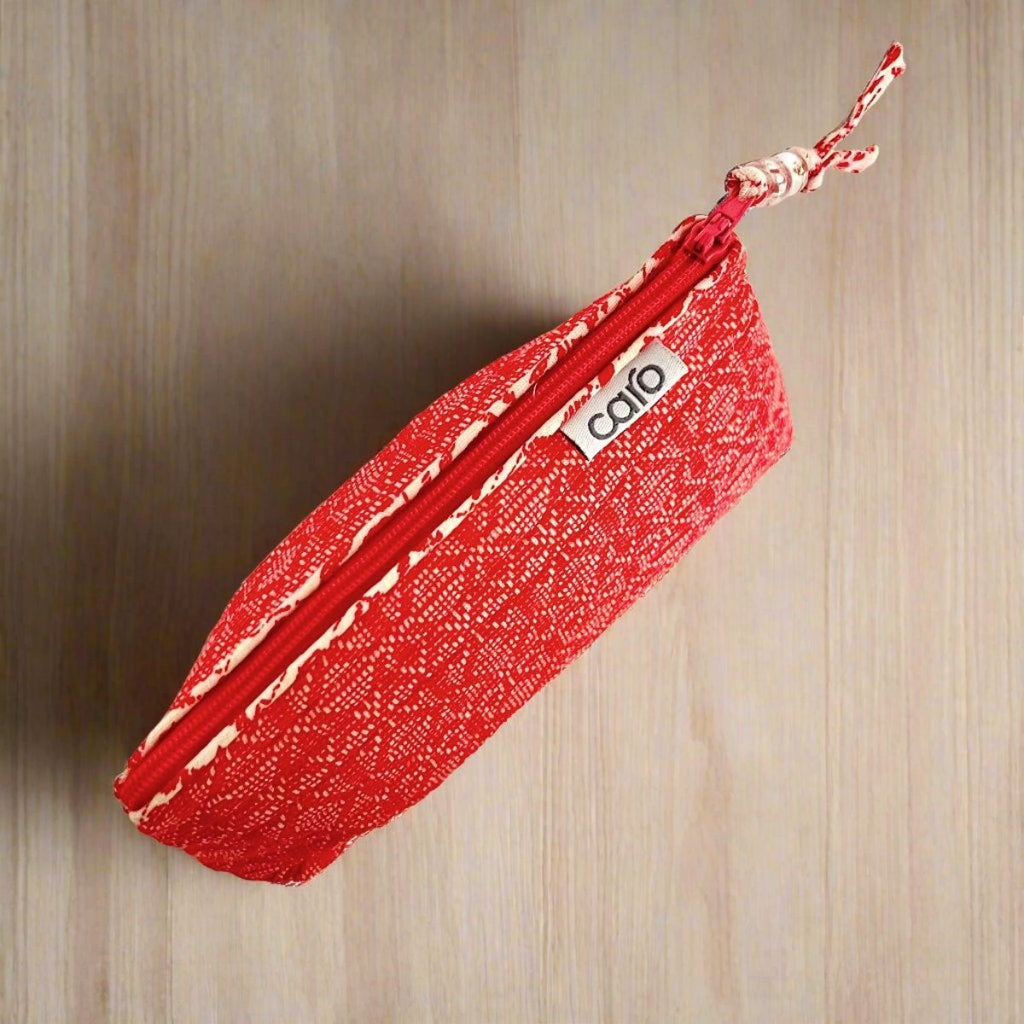 small red make up bag view from above