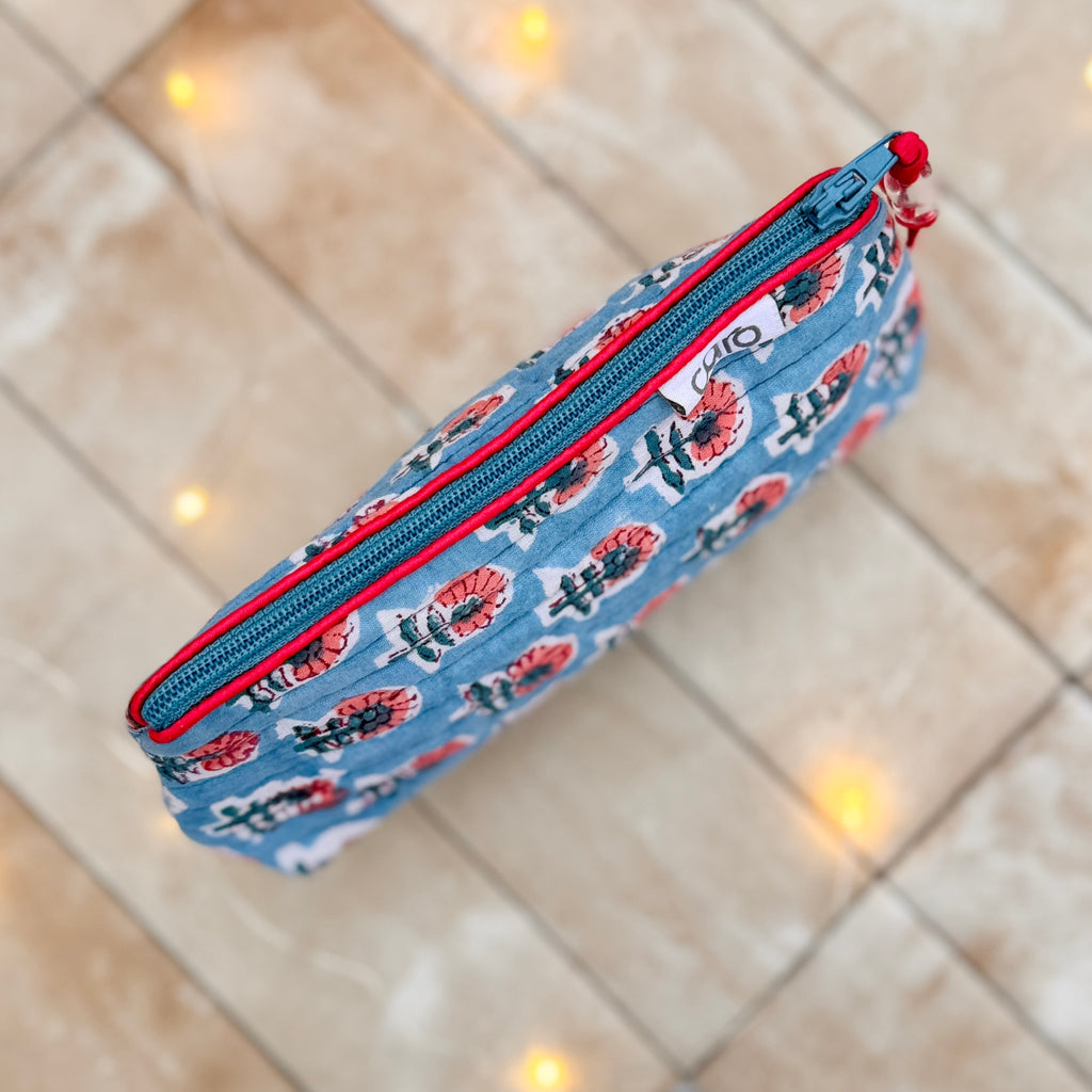 Blue small make up pouch with red and white pattern