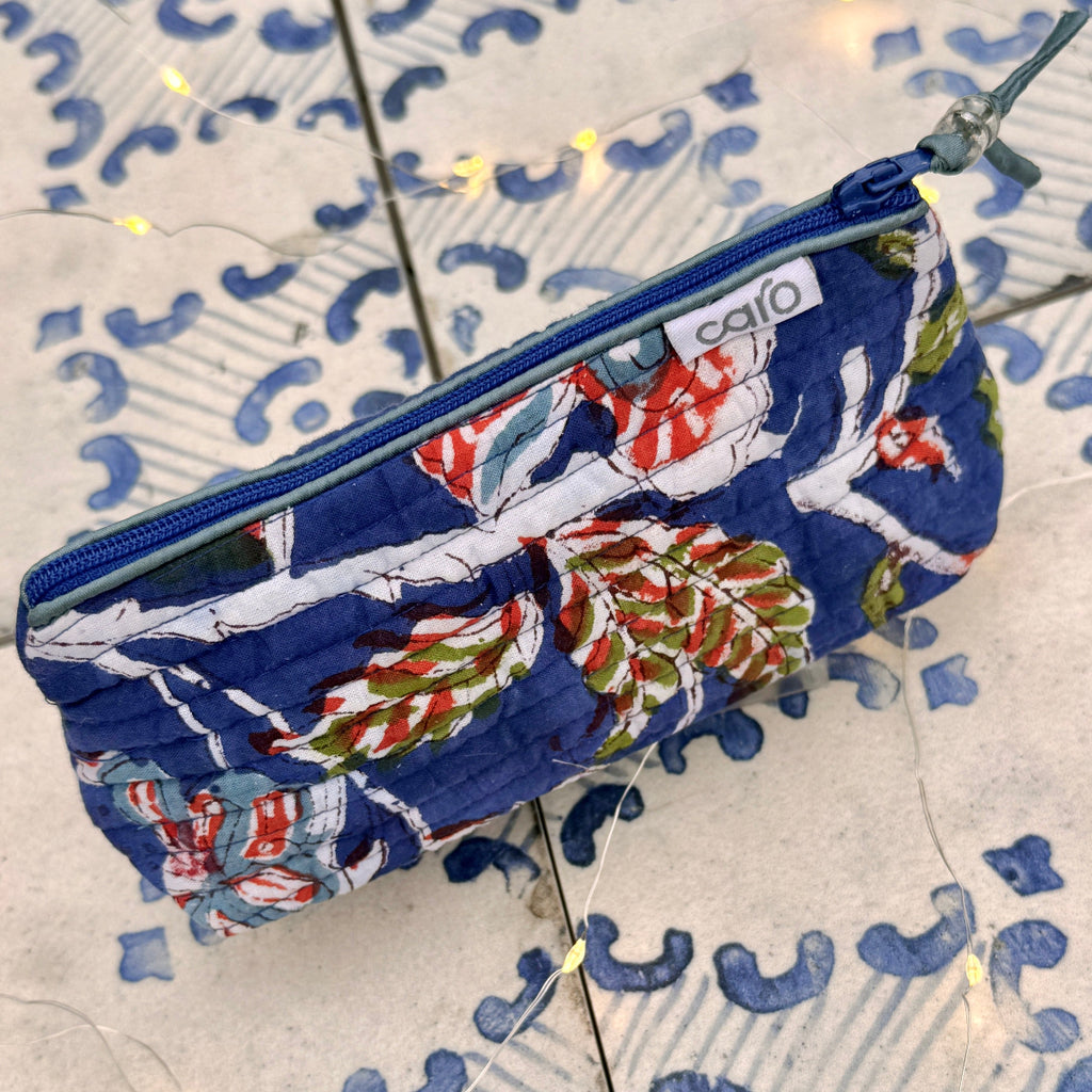 Fabric pouch with floral pattern on a textured surface