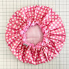 waterproofed shower cap in red and white spot print 