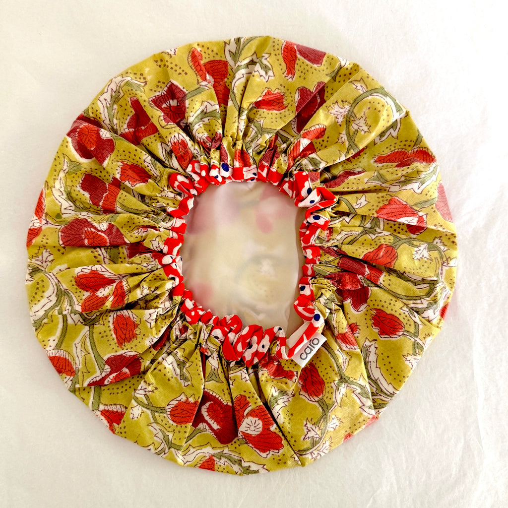 Inside view of poppies shower cap with contrast orange floral trim