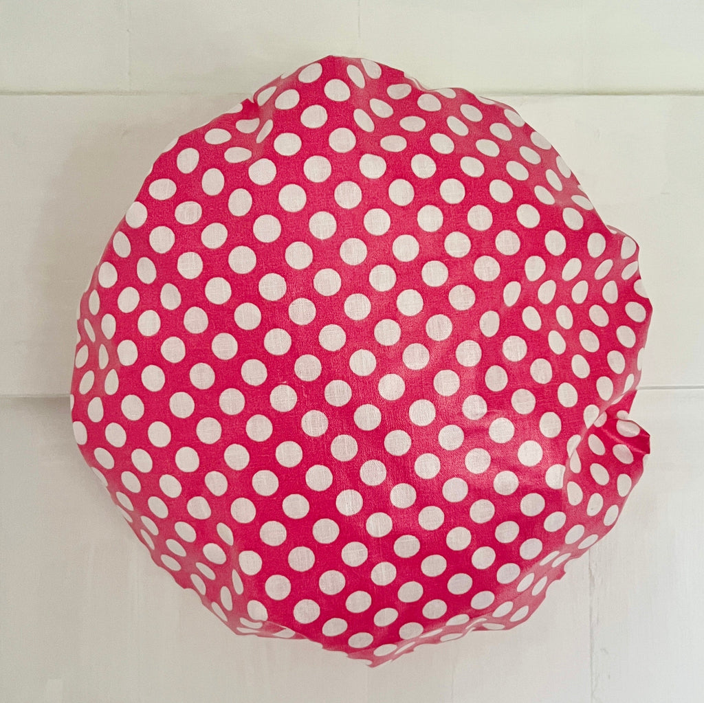 waterproofed shower cap in red and white spot print and white water resistant lining by caro london