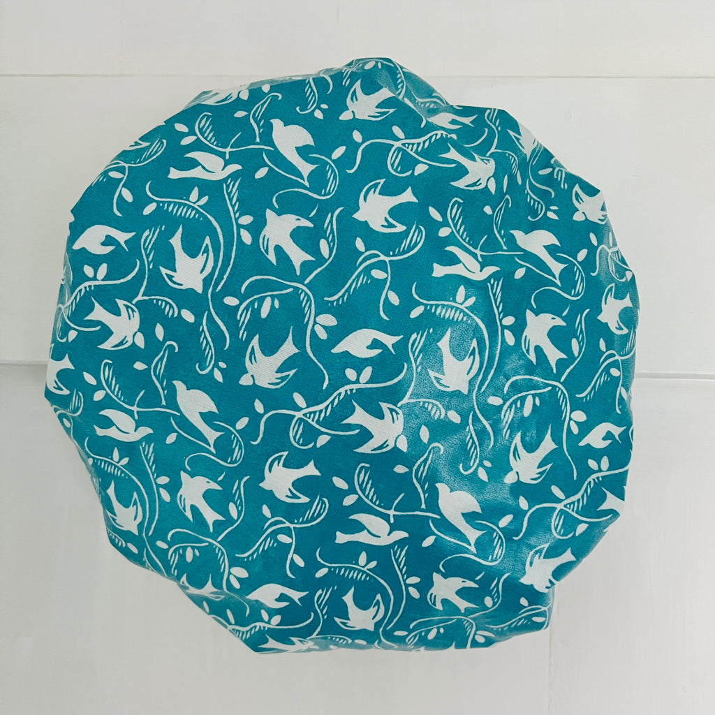 photo of outside of best selling teal swallow cotton print waterproofed shower cap