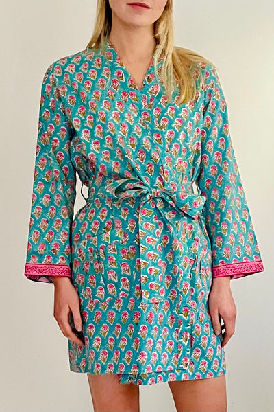 short kimono robe in hand printed small floral motif in pink on turquoise ground by caro london