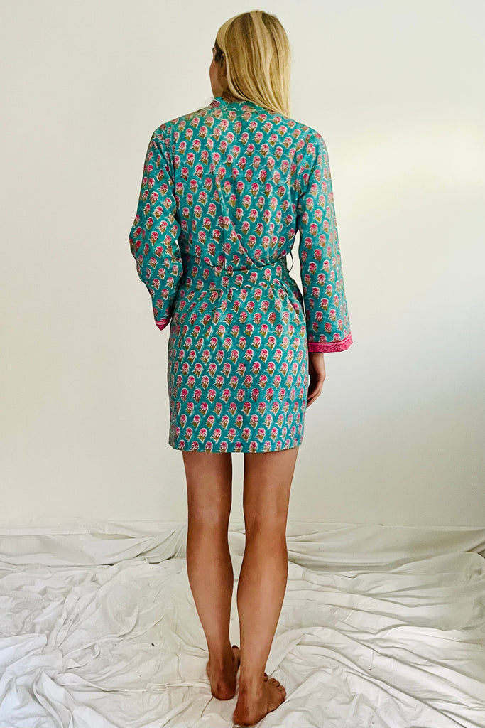 short kimono robe in hand printed small floral motif in pink on turquoise ground by caro london