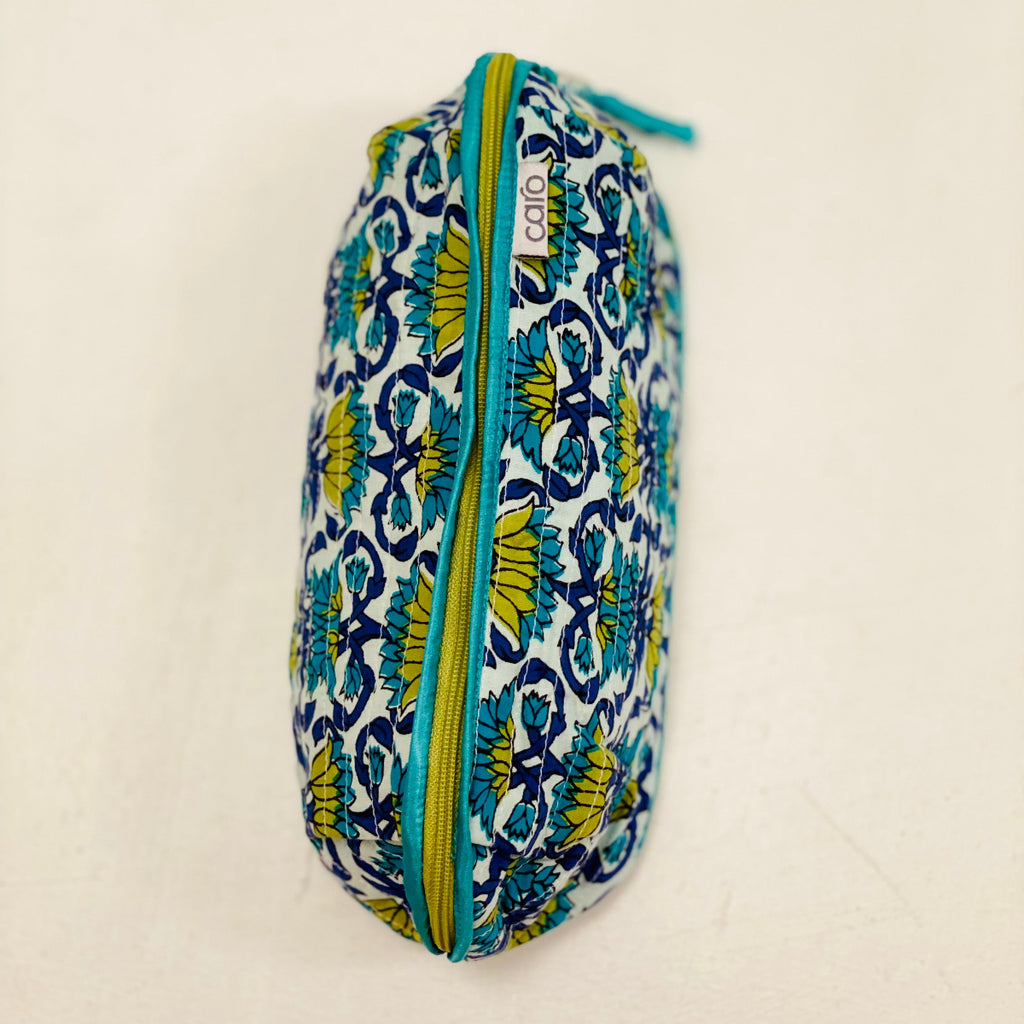 Patterned make up bag with a zipper on a beige background