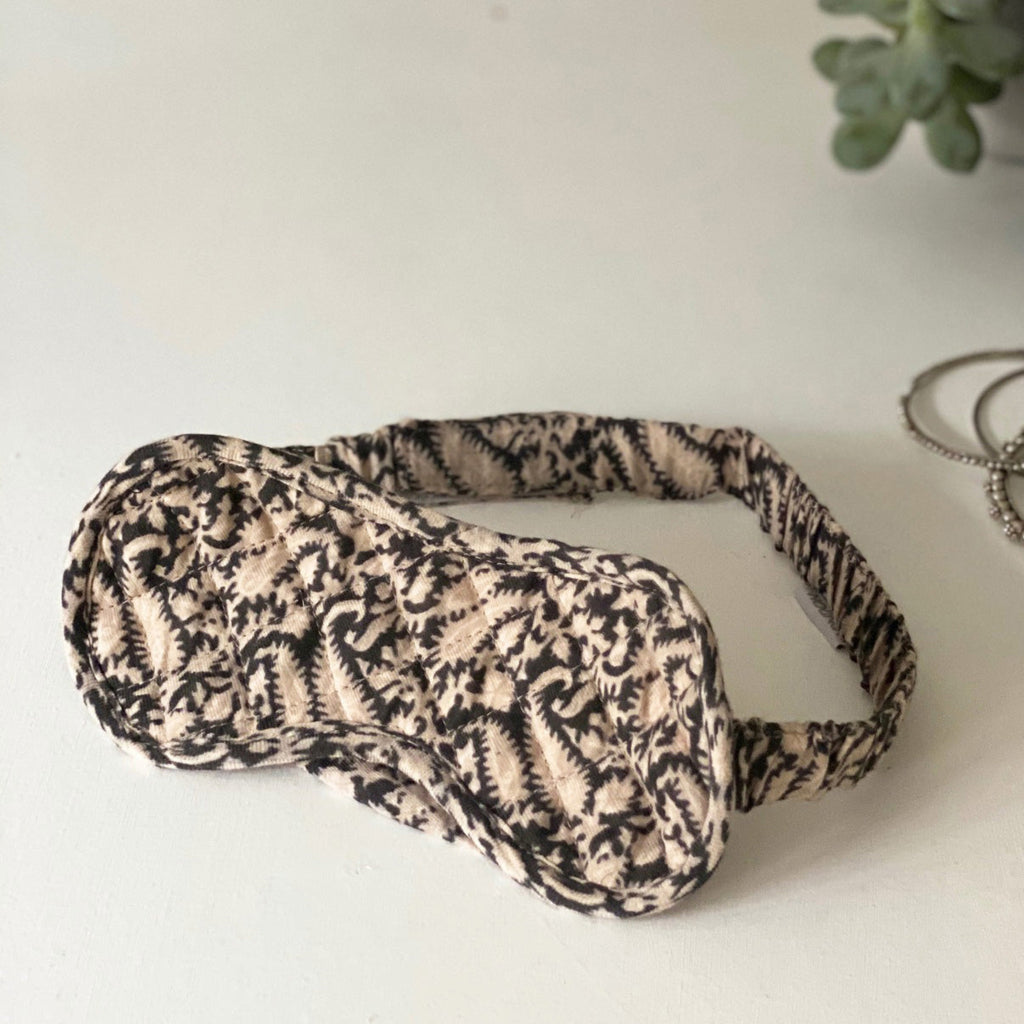 ladies quilted sleep mask in cream and black paisley print in soft cotton with adjustable strap by caro london